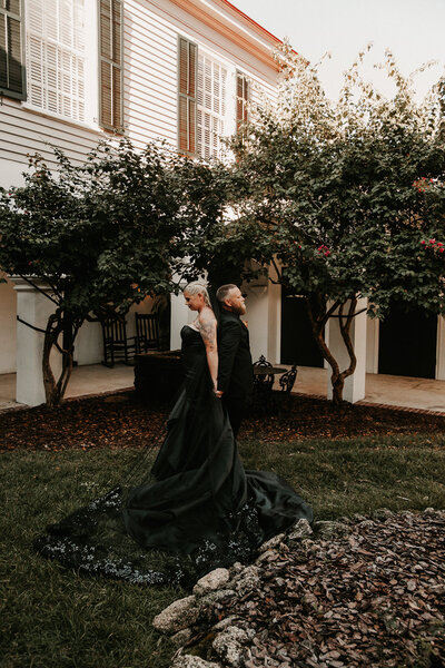 Couple in all black at Penn a Peck House in St. Augustine during Micro Wedding