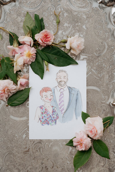 smiling-couple-watercolour-portrait-on-floral-backdrop