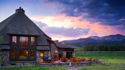 Resort photo with mountains and a setting sun in the background
