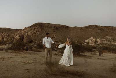 Husband and wife walking through a National Park after their elopement.