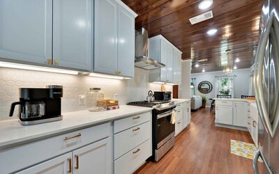 Fully equipped kitchen in this  three-bedroom, two-bathroom vacation rental home with historical charm in Waco, TX.