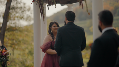 Bride and groom looking at each other smiling
