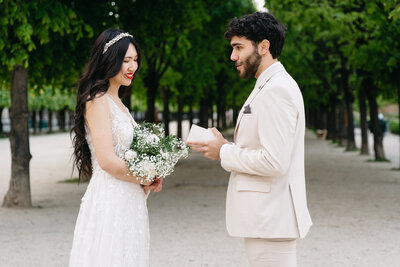 Couple reading vows in Paris