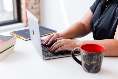 Therapist working on her laptop on a therapy intake