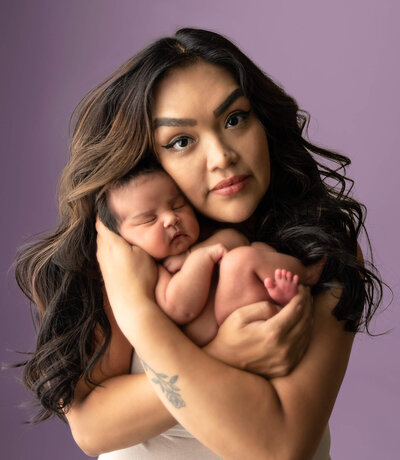 mother holding newborn