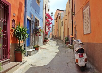 Vespa on colorful alley