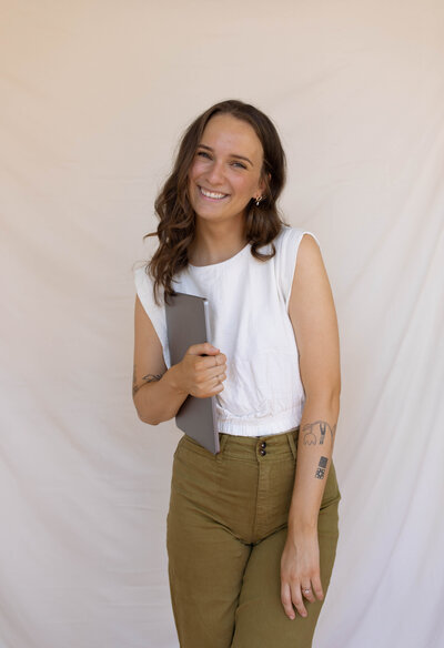 Creative Freelance Designer woman with hands on hips.
