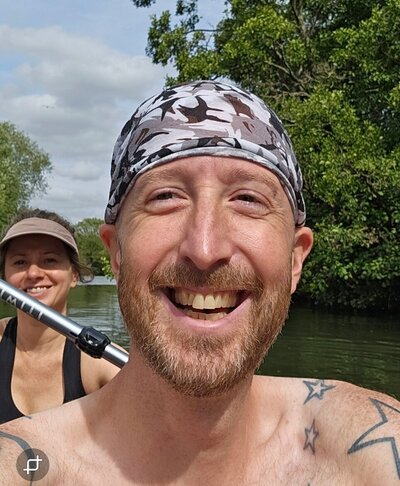 Rick our on the river while wearing the Optune device