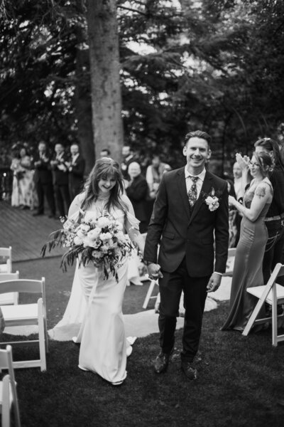 Black and white photo of a Bride and Groom getting married at Log Haven wedding venue in Salt Lake City Utah
