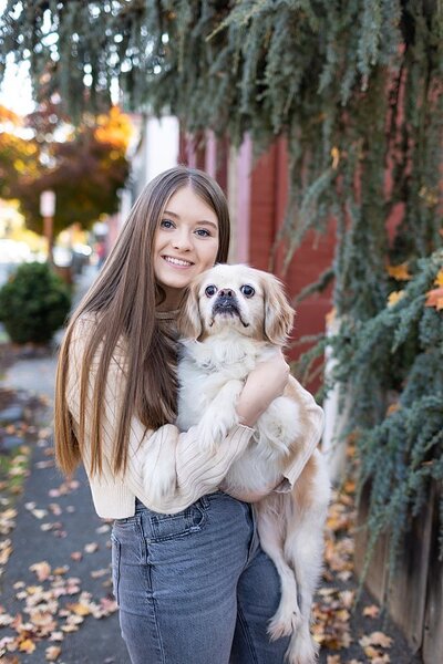 Girl holding cute dog in Jacksonville
