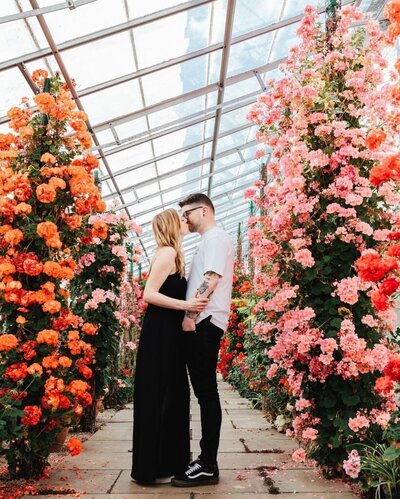 Couple surrounded by flowers at Temple Newsam park Leeds