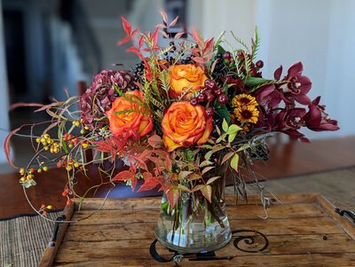 fall rose and orchid  flower arrangement