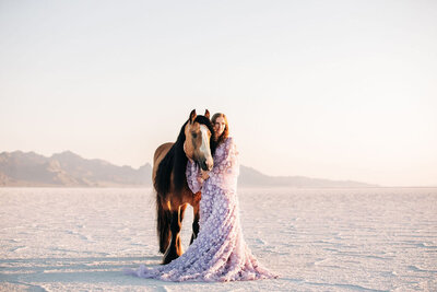 girl in prom dress with palomino horse