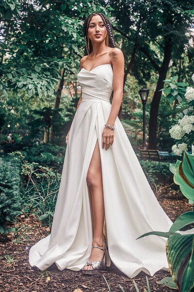 This gown's modified A-line silhouette accents curves while maintaining a full-skirted silhouette.