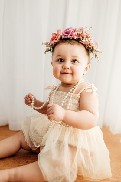 a sweetly sleeping newborn girl at her photography session