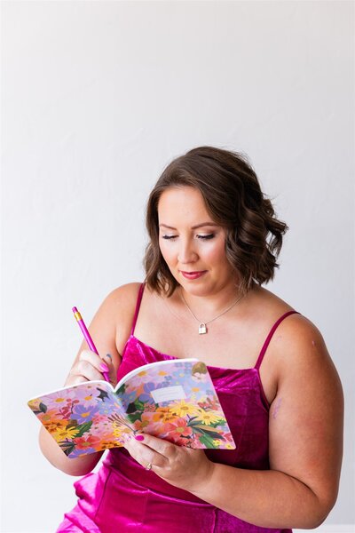 Depression therapist, Kathryn Konicek, writing notes in Canon City