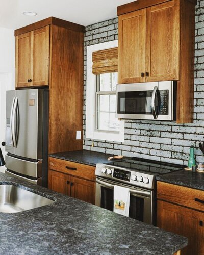 Kitchen design in Lake Martin with custom cabinets and granite counters.