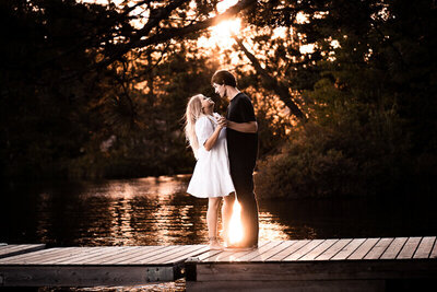 A couple dancing on the water at sunset for photos in Oshawa.