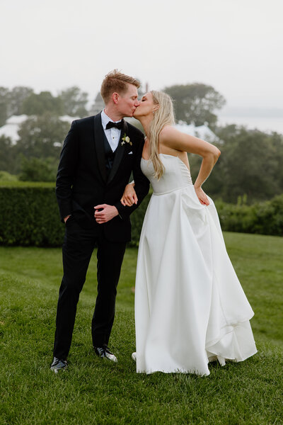 A bride and groom kissing on their wedding day