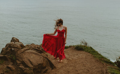 girl standing in sea grass at oregon coast