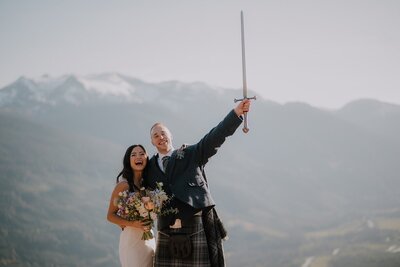 bride and groom by the lake