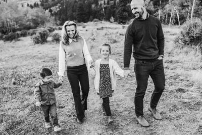 Black and white picture of a family walking in the mountains