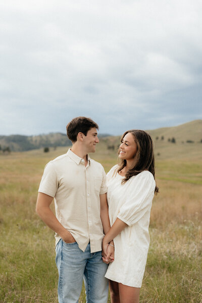 A couple smiling at each other at Wind Cave.