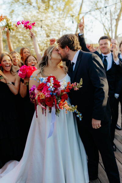 night time shot of bride and groom celebrating at their wedding reception in Arkansas