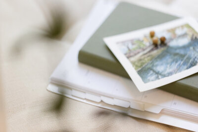 A watercolor painting on top of a stack of books