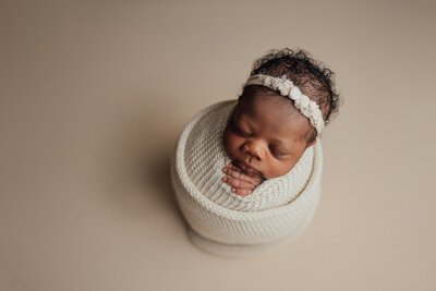 newborn baby girl wrapped during posed newborn session in Tampa, FL