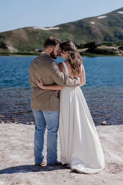 Bride and groom celebrate sustainable wedding in Colorado's Rocky Mountains.