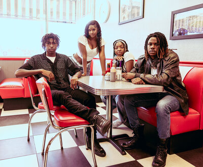 a group of high school seniors at a retro diner