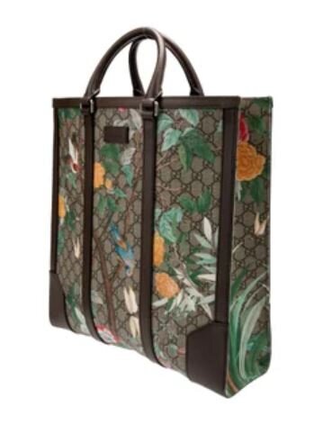 Pre-Loved Gucci Tote bag a floral and foliage print over the classic GG monogram canvas with brown leather trim and top handles styled as a statement work bag.