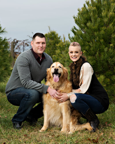 family portrait photographer takes photos with family pet dog in lansing michigan