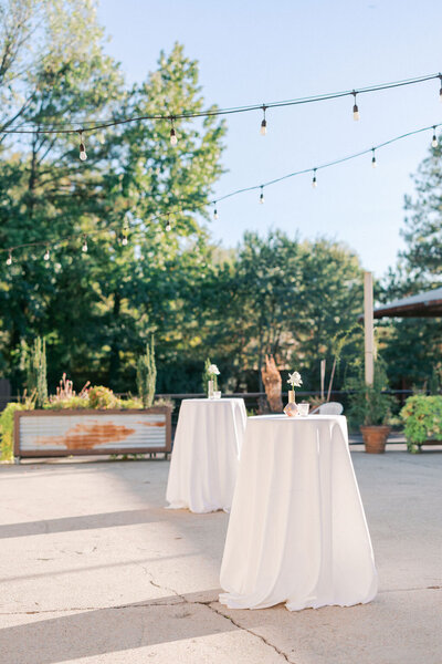 Elegant cocktail tables at wedding reception