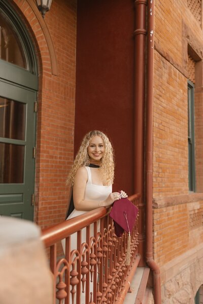 girl poses for graduation photos in mesa arizona