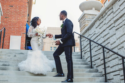 bride and groom on steps in chicago