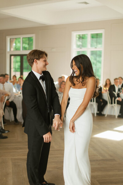 bride and groom laughing together