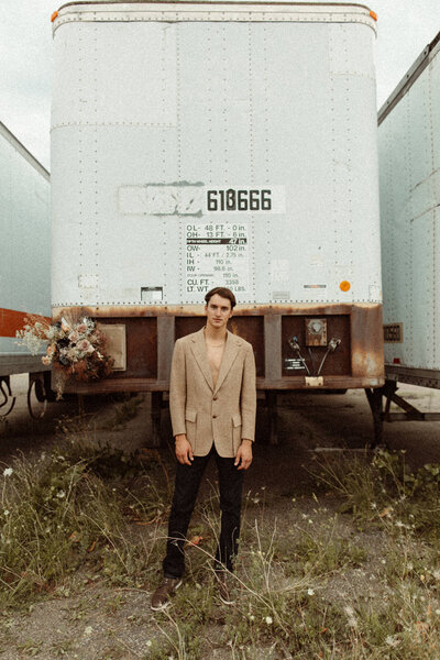 man standing in front of a semi truck