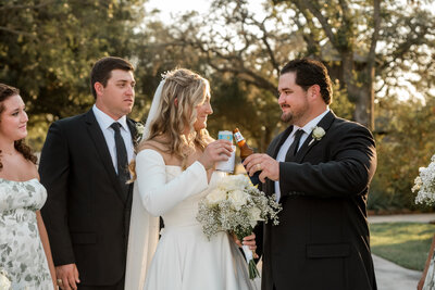 cheers beers bride and groom pattison house golden hour wedding