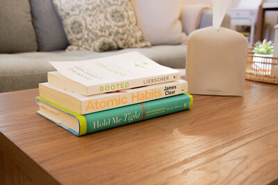 Picture of a stack of faith-based books. If you’re struggling with grief, loss, or trauma, a Christian therapist in Gilbert, AZ, can help you move forward. Find your sense of peace while strengthening your faith. 
