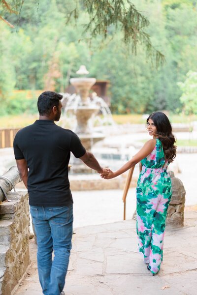 Bride leading groom engagement shoot