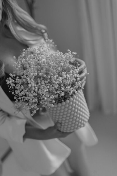 Martina Biljan, copywriter and creative brand strategist, placing a vase on a pedestal