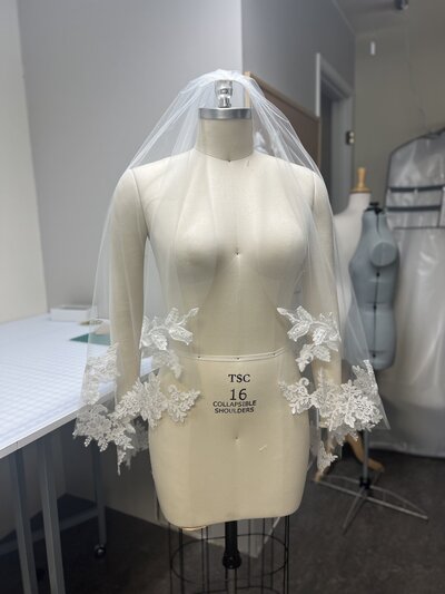 a custom lace veil after completion from the front
