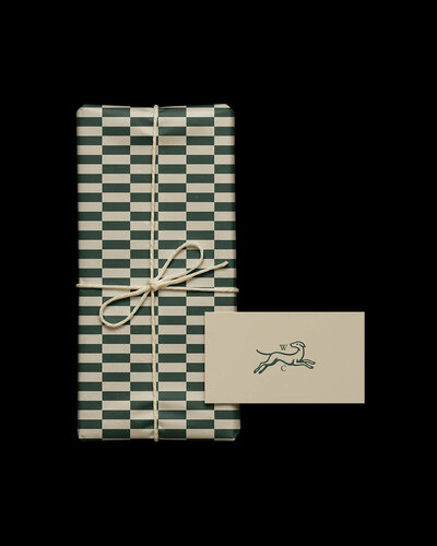 Packaging and brand identity for luxury dog treats with custom heritage pattern and hunting dog icon.