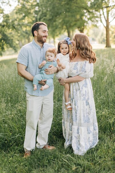 family with kids in a field