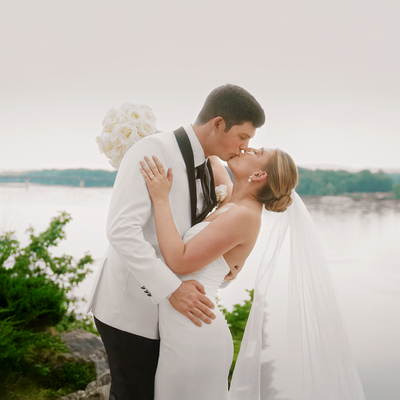 Video thumbnail showcasing Tessa and Garrett Vance’s wedding at Hermann Hill Weddings in Hermann, Missouri, featuring Tessa walking down the aisle with her dad, Garrett in tears, and a joyful reception with dancing, laughter, and heartfelt toasts.