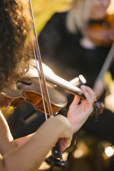 Woman playing violin in outdoor events