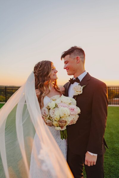 bride and groom pose for bridal portraits in oklahoma