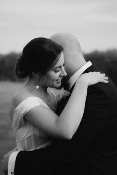 A couple walking and smiling at their wedding in the Hunter Valley